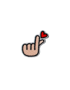 Hand holding heart patch